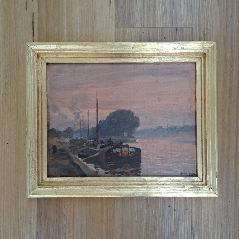 Hand-carved frame finished with gold leaf.