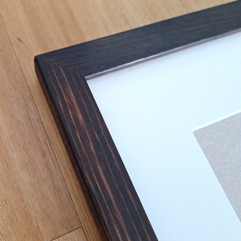 Detail of Tasmanian Oak picture frame ebonized over jarrah stain. Fitted with non-reflective glass.